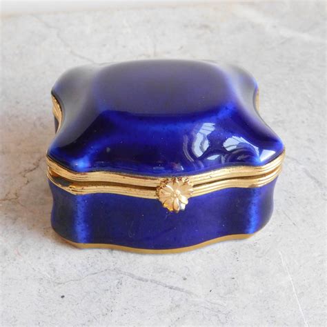 small blue metal trinket box with hinged lid|trinket box lid designs.